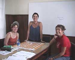 Teacher helping students with spanish material